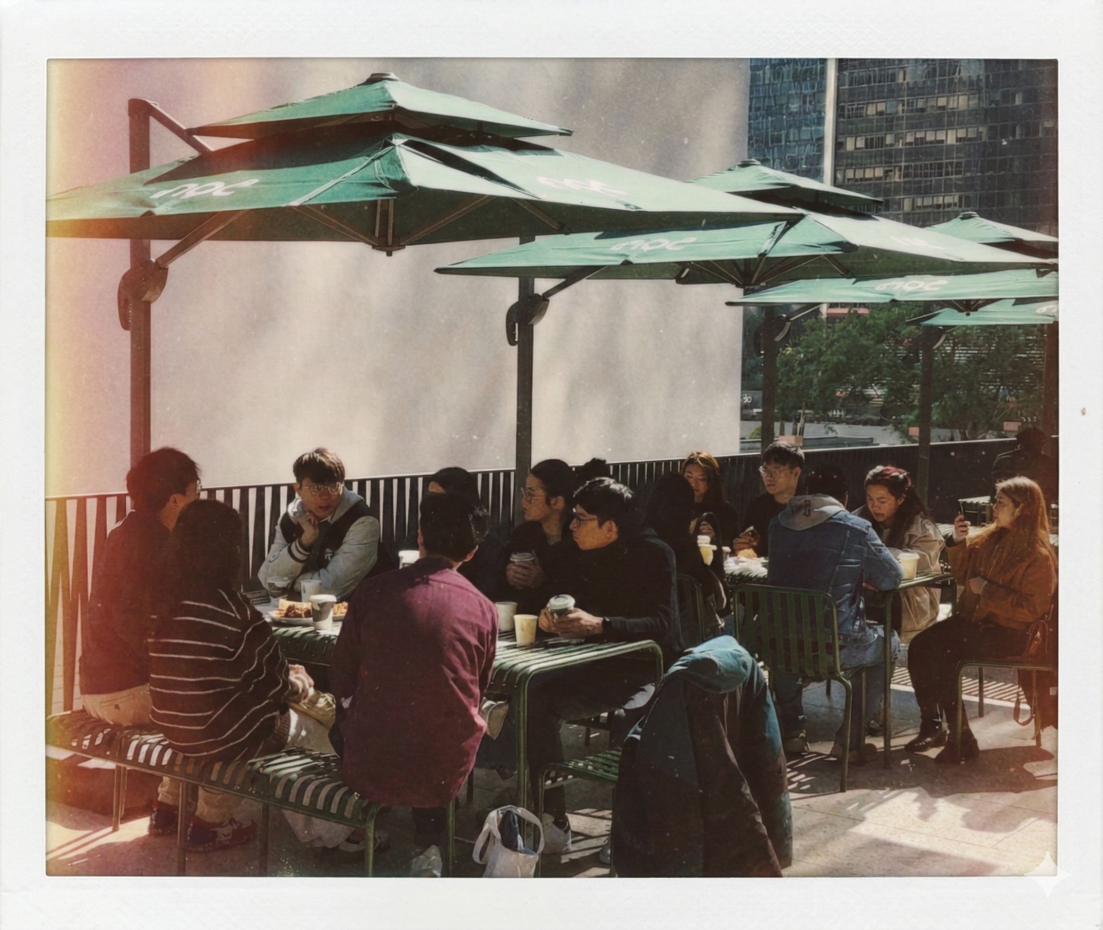 House of Stewards community gathering around tables at an outdoor cafe